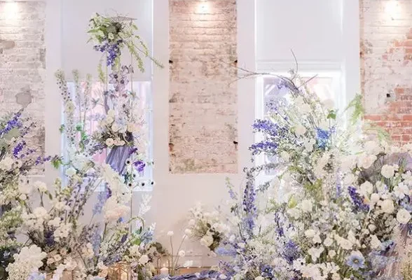 19-a-gorgeous-very-peri-wedding-altar-done-with-white-and-very-peri-blooms-candle-lanterns-and-petals-is-amazing-and-bold